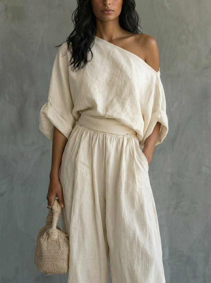 Conjunto de lino para mujer en color blanco roto, con top con hombros al aire y pantalones ajustados